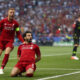 Mohamed Salah of Liverpool celebrates with Jordan Henderson