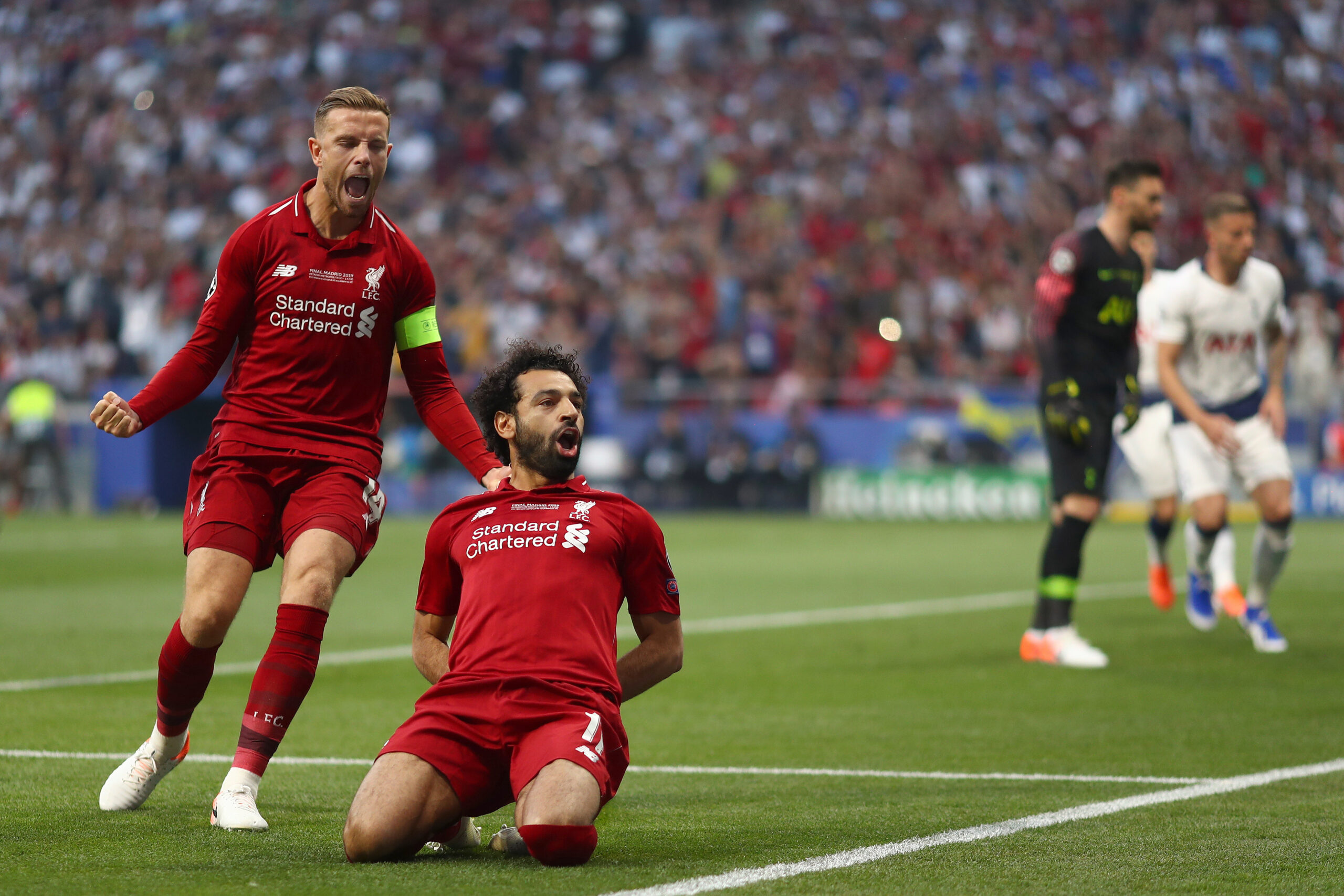 Mohamed Salah of Liverpool celebrates with Jordan Henderson