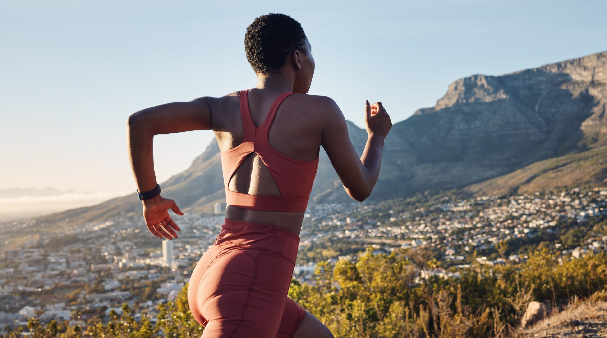 Back, black woman and running in nature